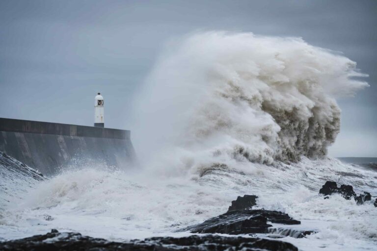 Storm waves crashing into pier