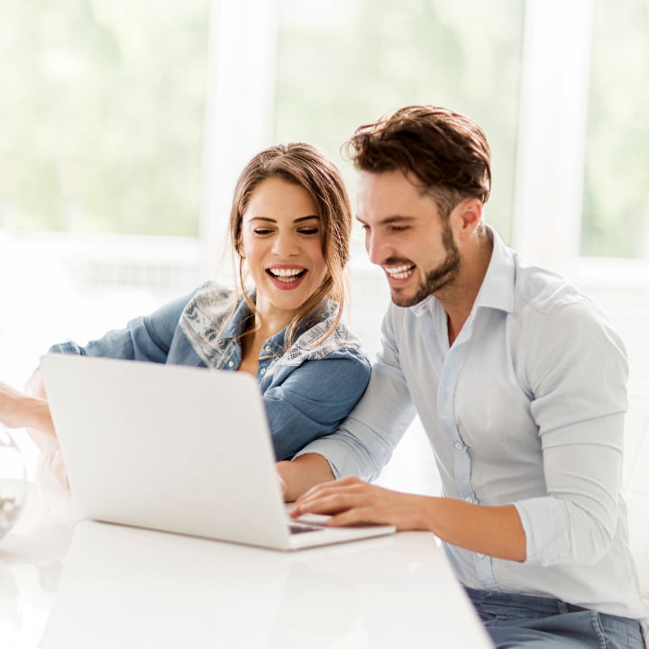 a couple on their laptop