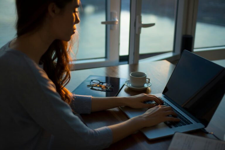 Woman typing on computer